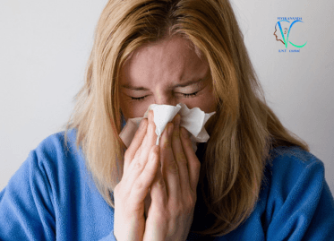 Common Ear Nose Throat Problems | Young girl sneezing, experiencing ENT symptoms | Vivekananda ENT Clinic, Kolkata | Compassionate care by Dr. Pinaki Mazumder, trusted ENT specialist for sinus, sore throat, and allergy solutions in Kolkata.